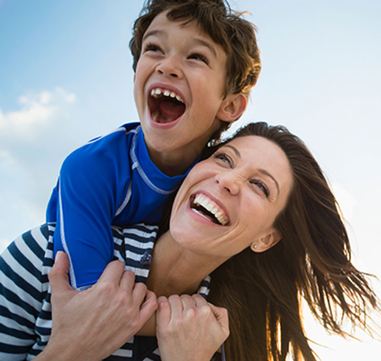 Mom and child boy laughing happily