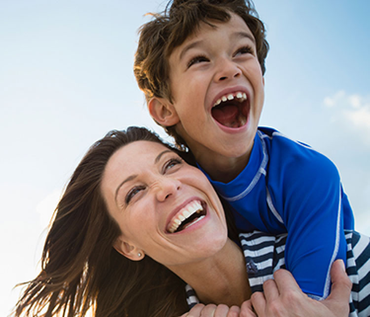 Mom and boy lauging